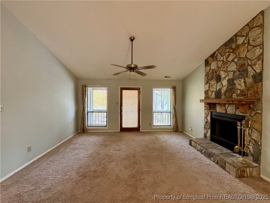 1899 Tryon Drive, Unit 8 Fayetteville, NC 28303 - Photo 6 of 21 a view of empty room with fireplace and windows
