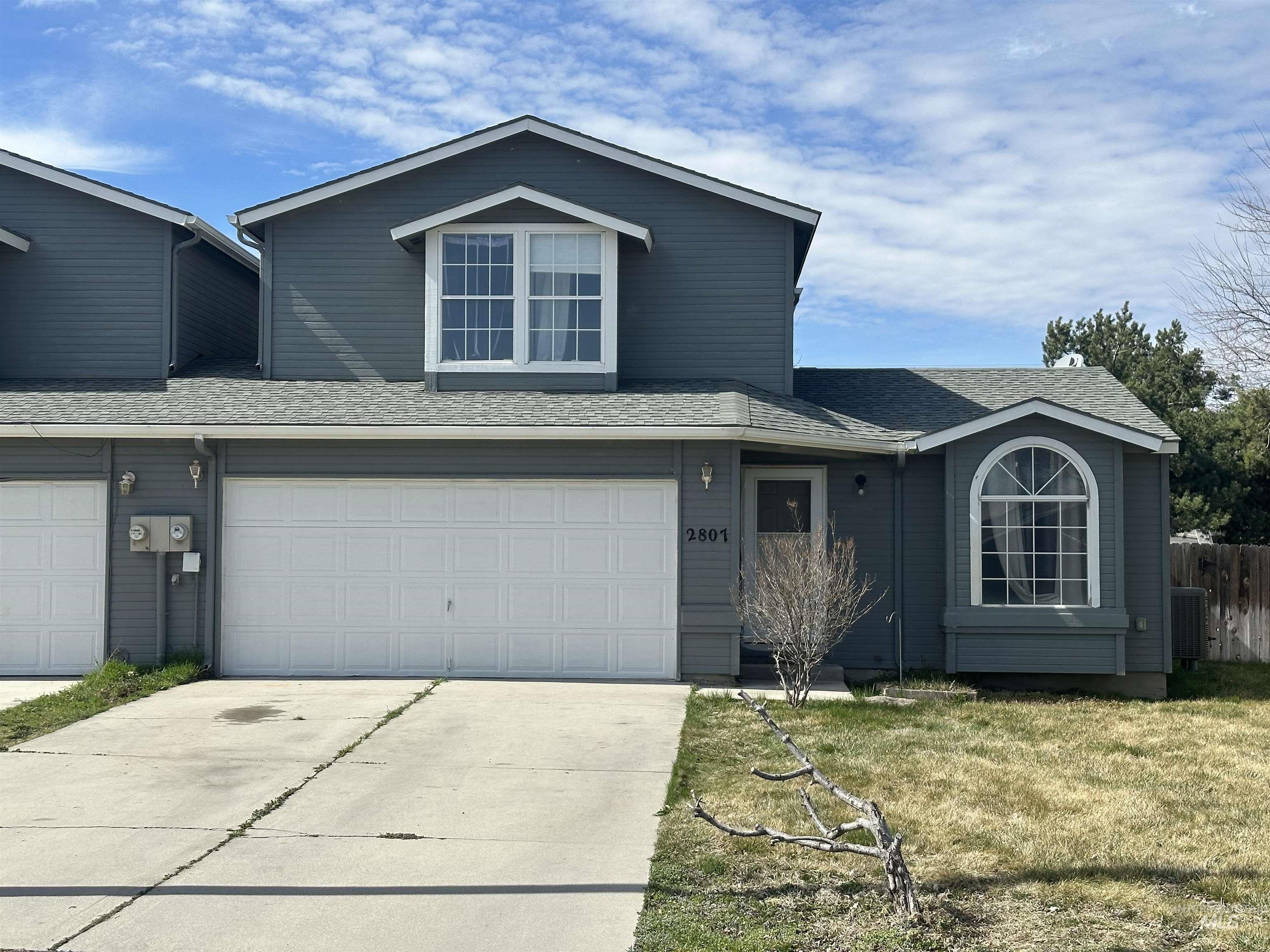 2807 Laurel Way Nampa, ID 83686 - Photo 1 of 1 Traditional-style house featuring a shingled roof, concrete driveway, and a garage