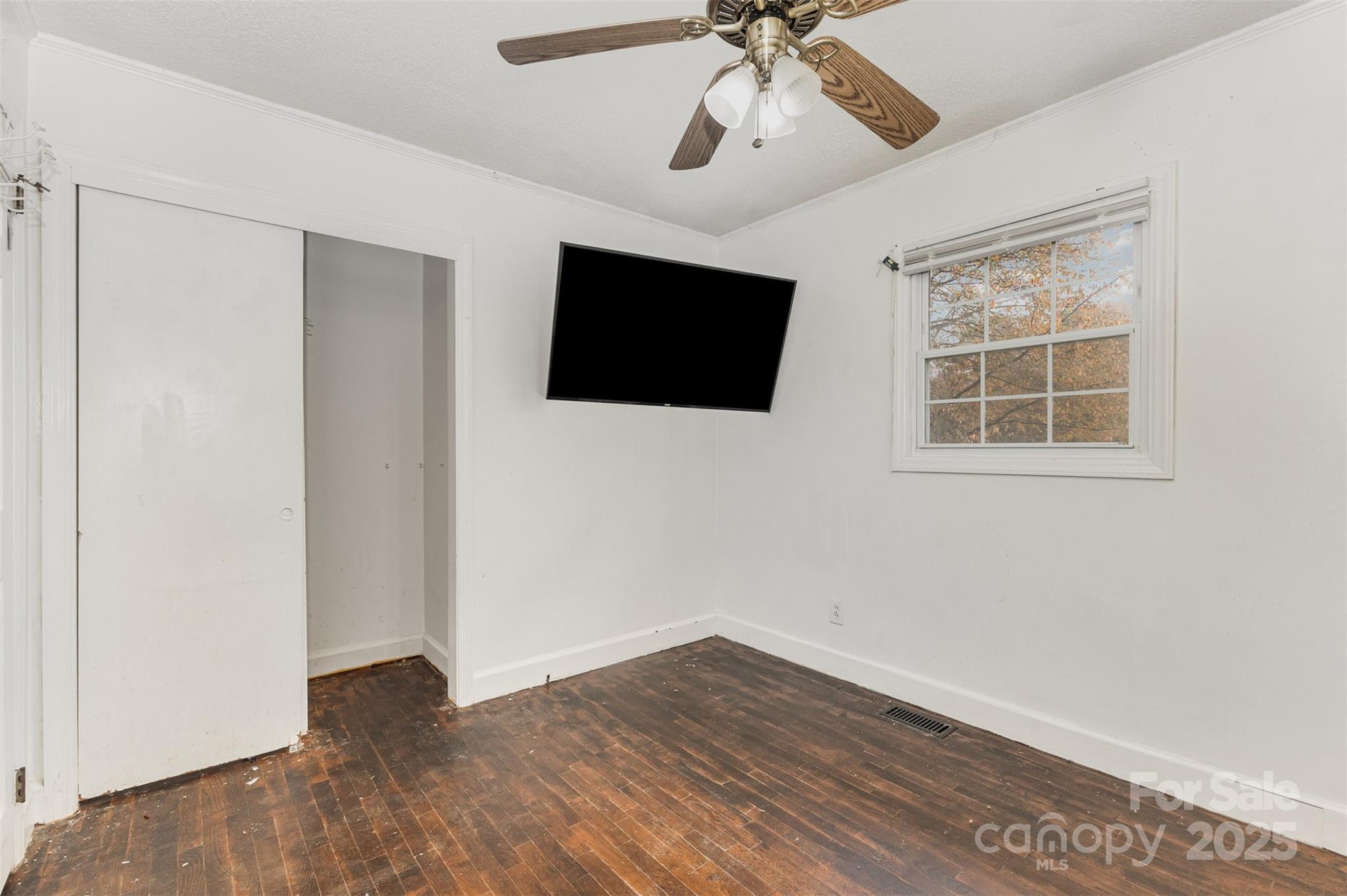 281 South Sutton Road Fort Mill, SC 29708 - Photo 12 of 21 a view of a big room with wooden floor and windows