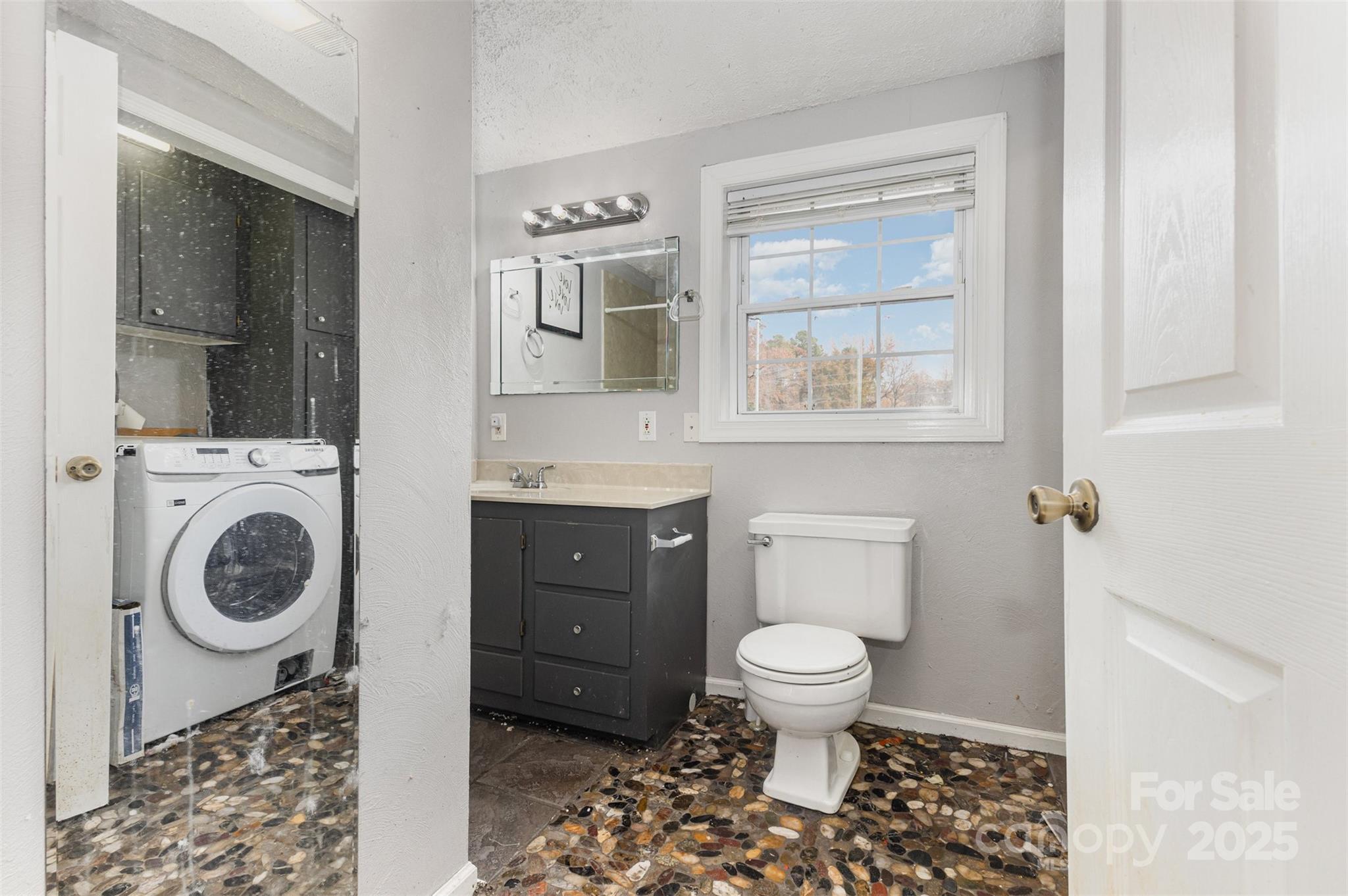281 South Sutton Road Fort Mill, SC 29708 - Photo 14 of 21 a bathroom with a toilet a sink and a window