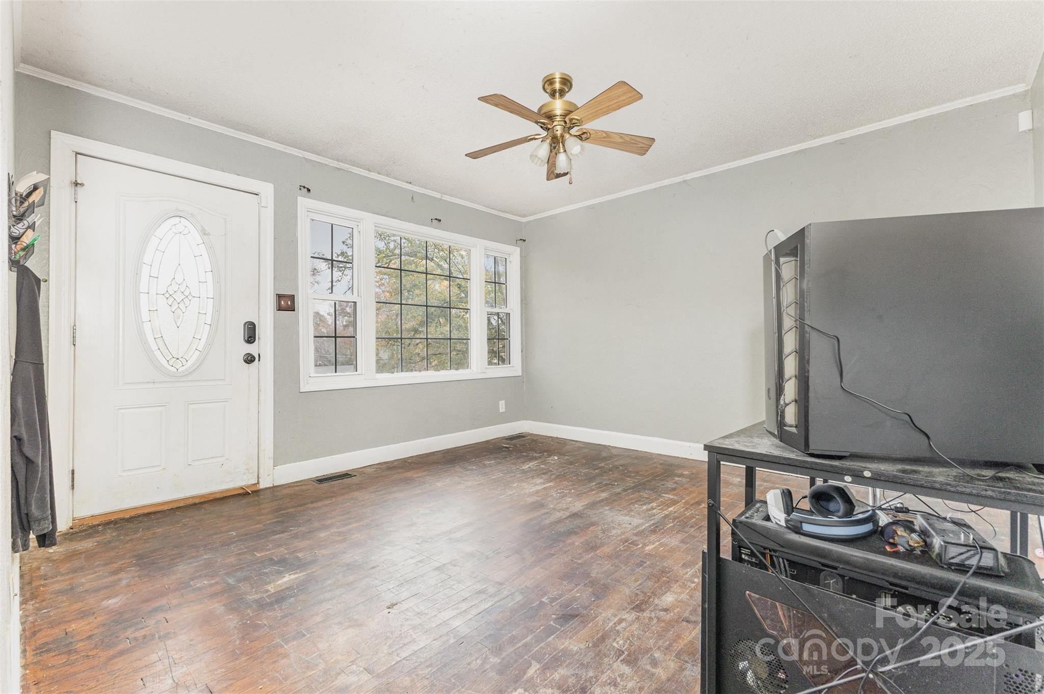 281 South Sutton Road Fort Mill, SC 29708 - Photo 3 of 21 an empty room with windows and fan