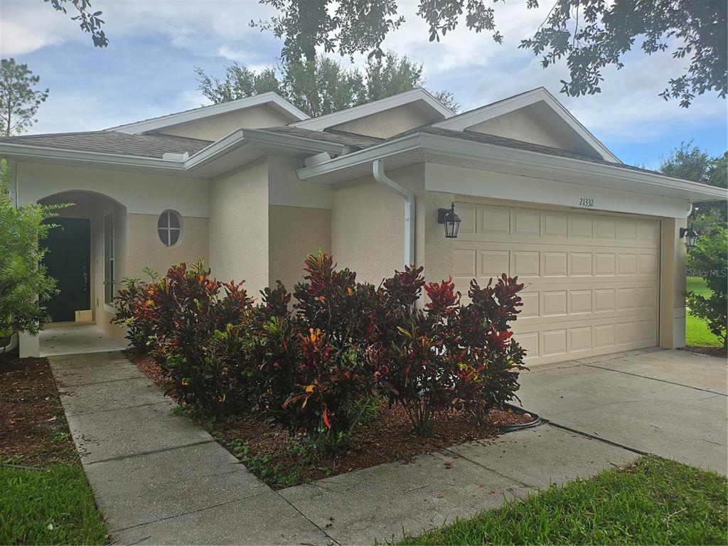 21332 Morning Mist Way Land O Lakes, FL 34637 - Photo 1 of 25 front view of a house