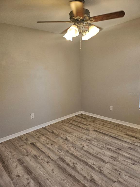 21332 Morning Mist Way Land O Lakes, FL 34637 - Photo 22 of 25 a view of empty room with wooden floor