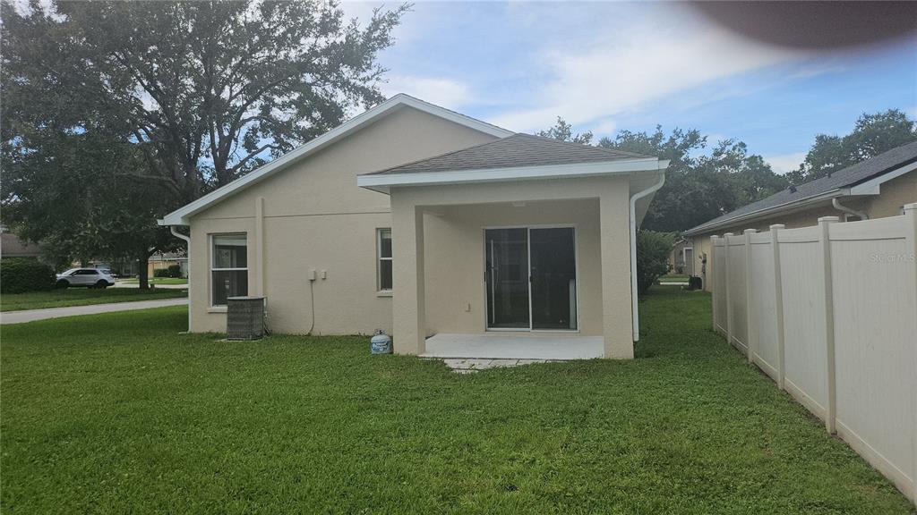 21332 Morning Mist Way Land O Lakes, FL 34637 - Photo 25 of 25 a view of a house with a yard