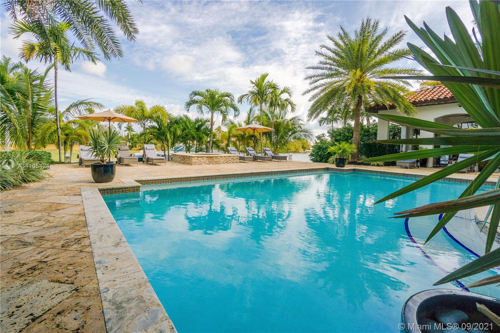 1201 Northeast 83rd Street Miami, FL 33138 - Photo 11 of 65 a view of swimming pool with a table and chairs