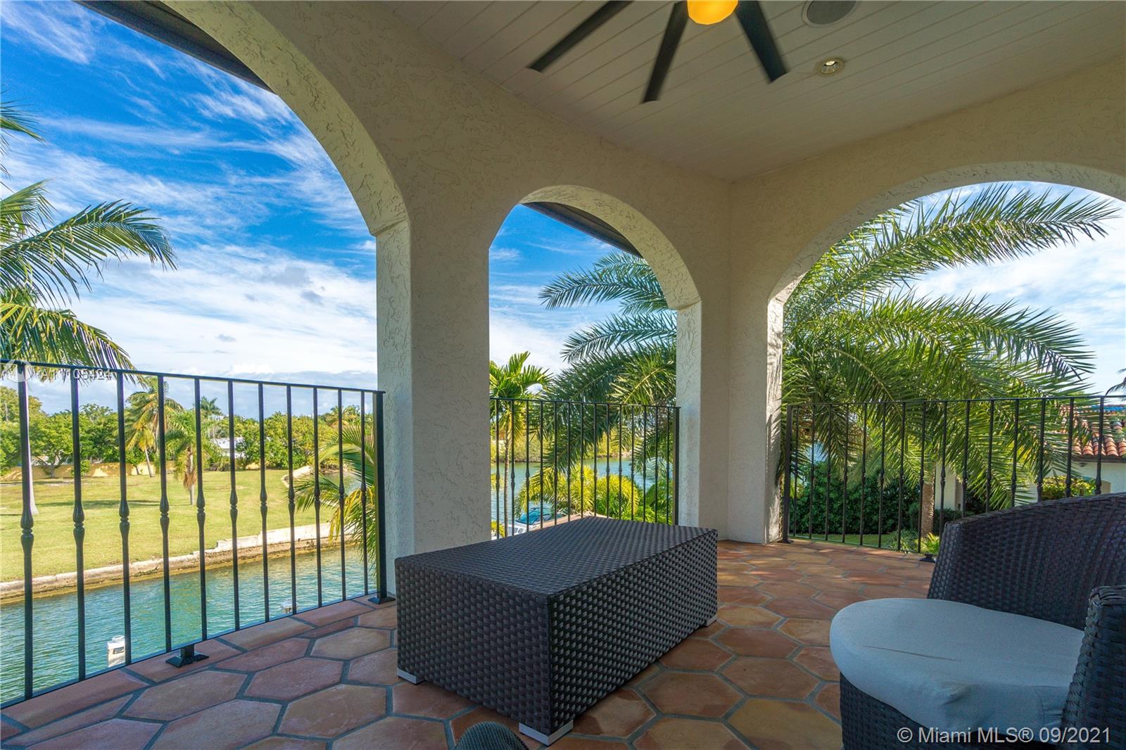 1201 Northeast 83rd Street Miami, FL 33138 - Photo 38 of 65 a living room with furniture and a floor to ceiling window