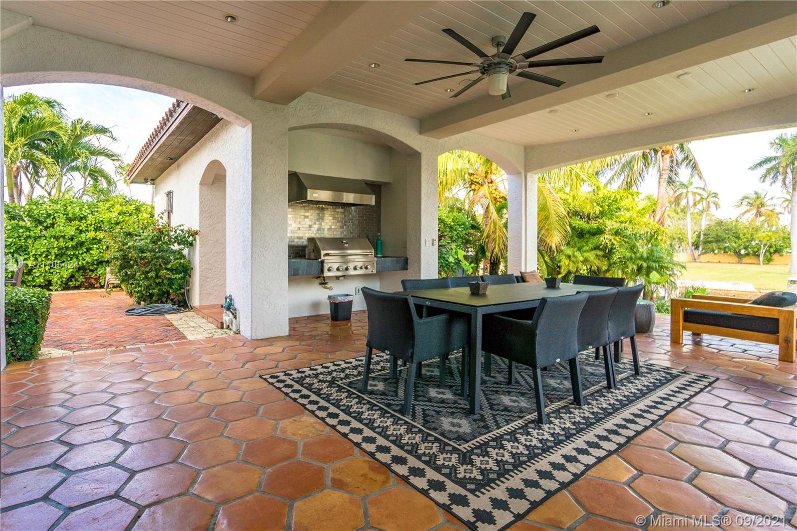 1201 Northeast 83rd Street Miami, FL 33138 - Photo 47 of 65 a outdoor dining space with furniture