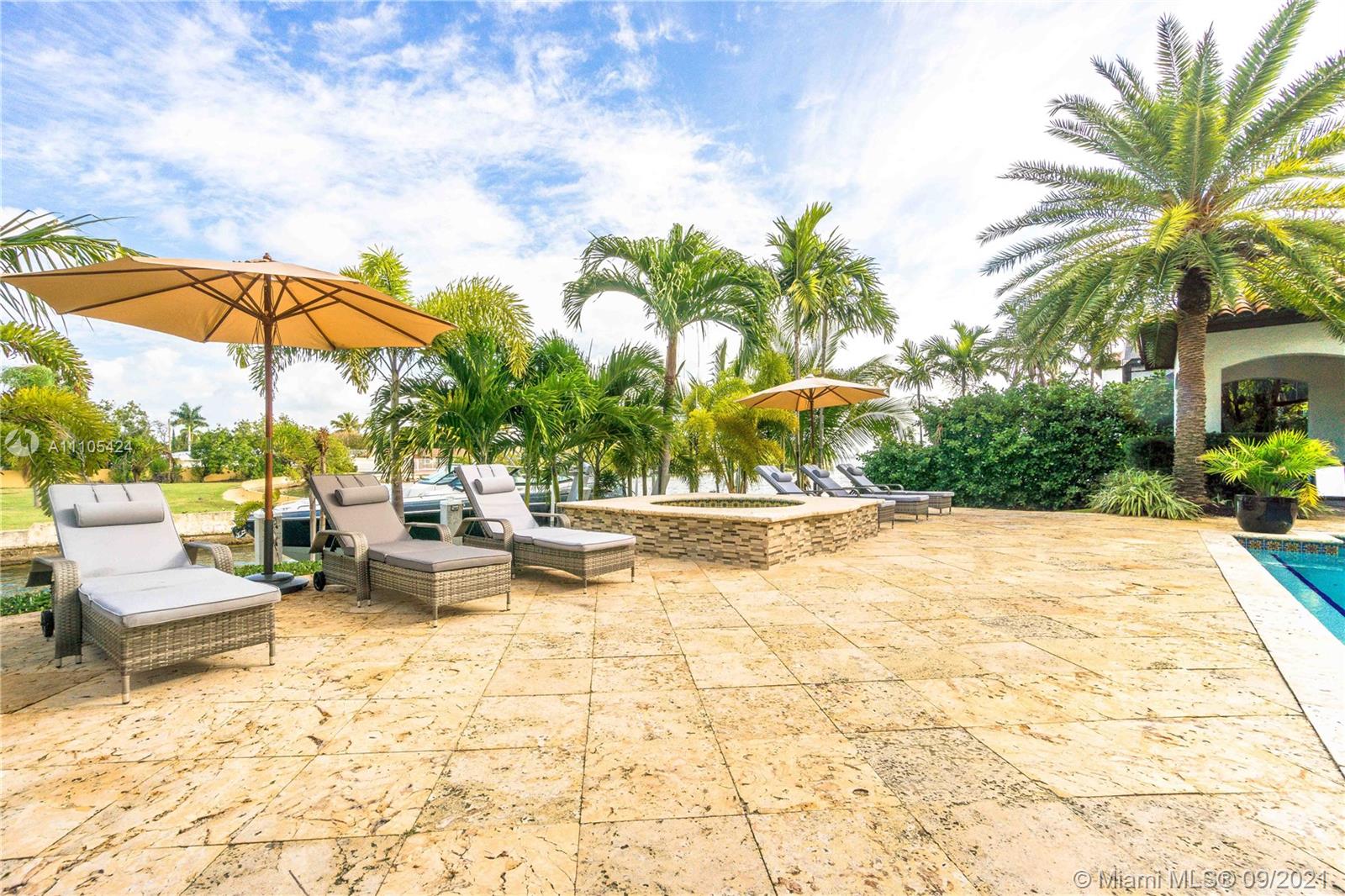 1201 Northeast 83rd Street Miami, FL 33138 - Photo 49 of 65 a view of swimming pool with outdoor seating and plants