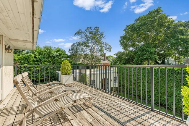 a balcony view with a garden space