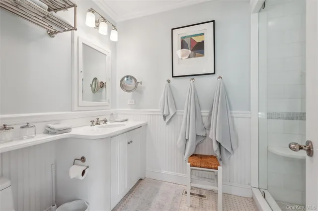 a kitchen with a dining table chairs and white appliances