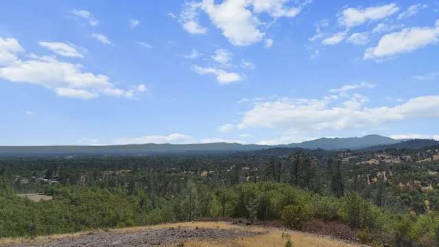 a view of a town with mountains in the background