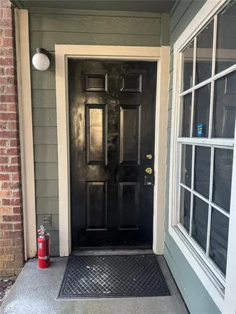 a view of a door and a window