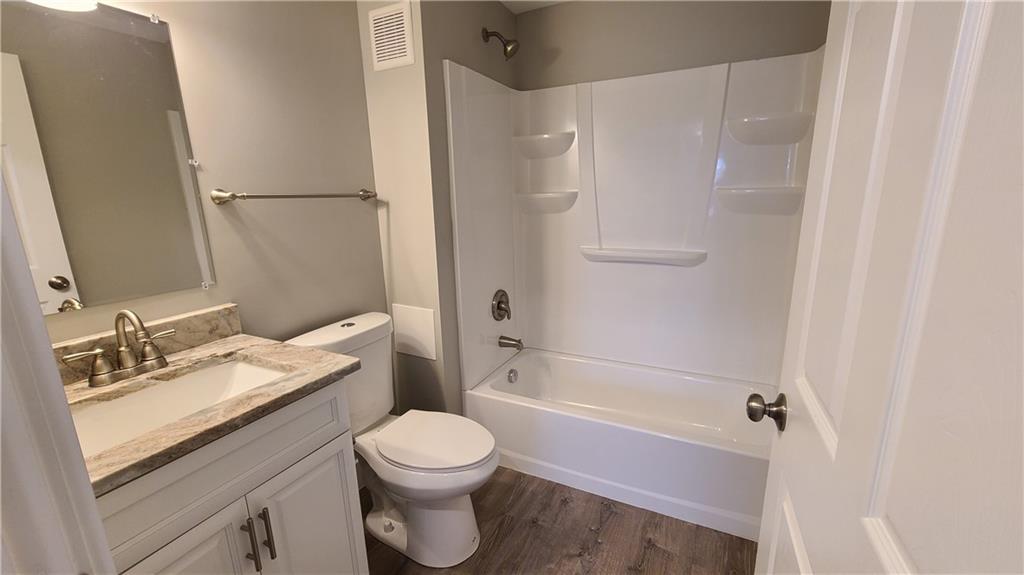 1331 Freeport Road Cheswick, PA 15024 - Photo 27 of 32 a bathroom with a granite countertop sink toilet and shower