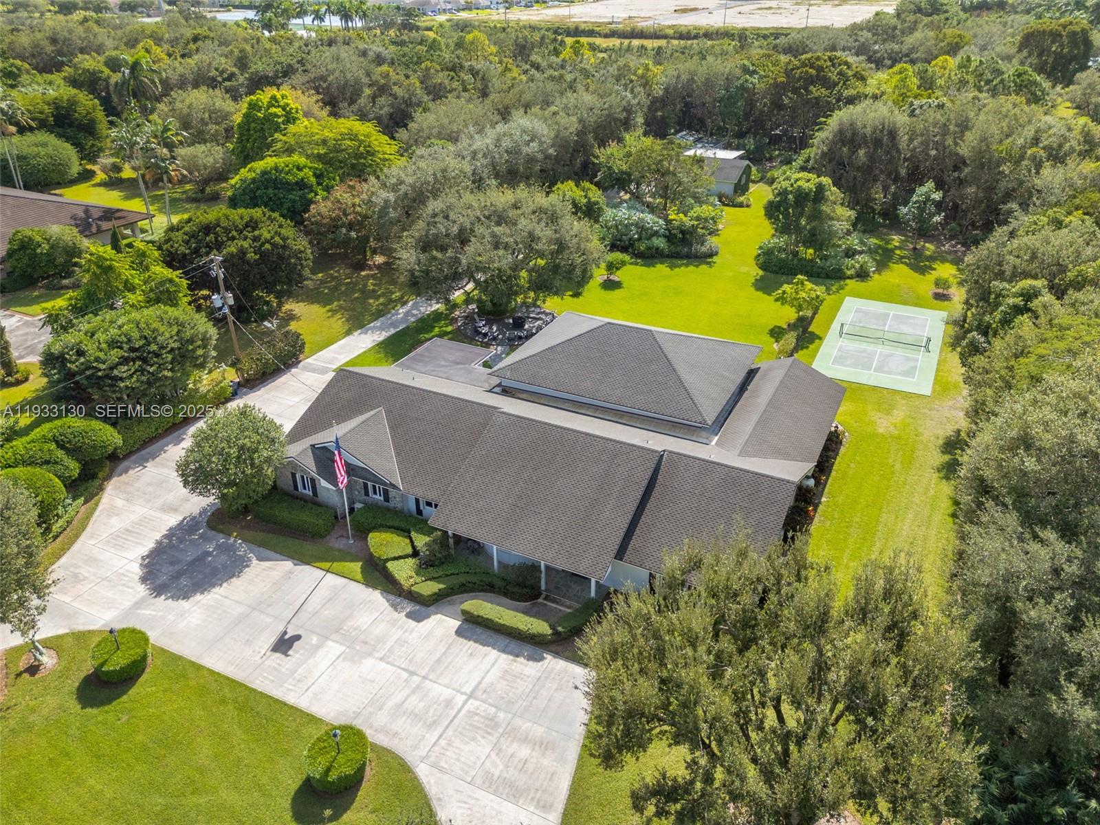 18000 Southwest 288th Street Homestead, FL 33030 - Photo 2 of 10 an aerial view of a house with a swimming pool