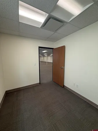 an empty room with closet area