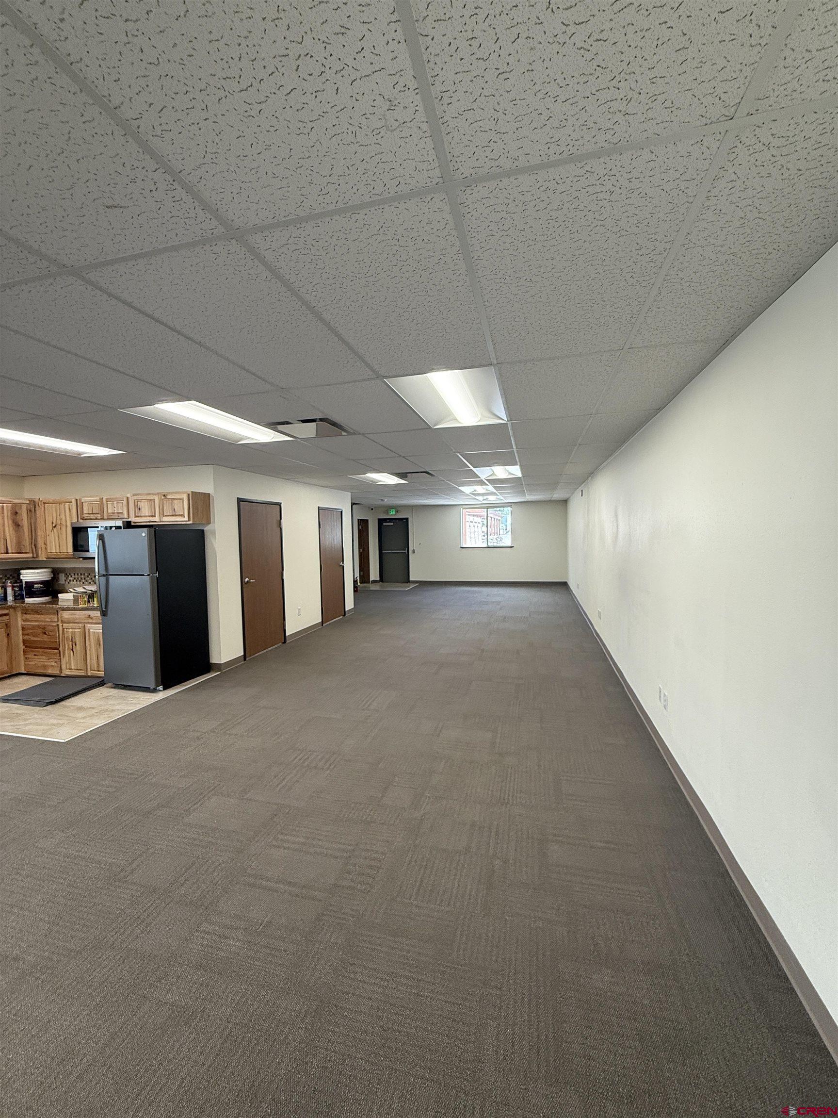 675 Industrial Boulevard, Unit 103 AND GARAGE Delta, CO 81416 - Photo 17 of 31 a view of a hallway with an empty room