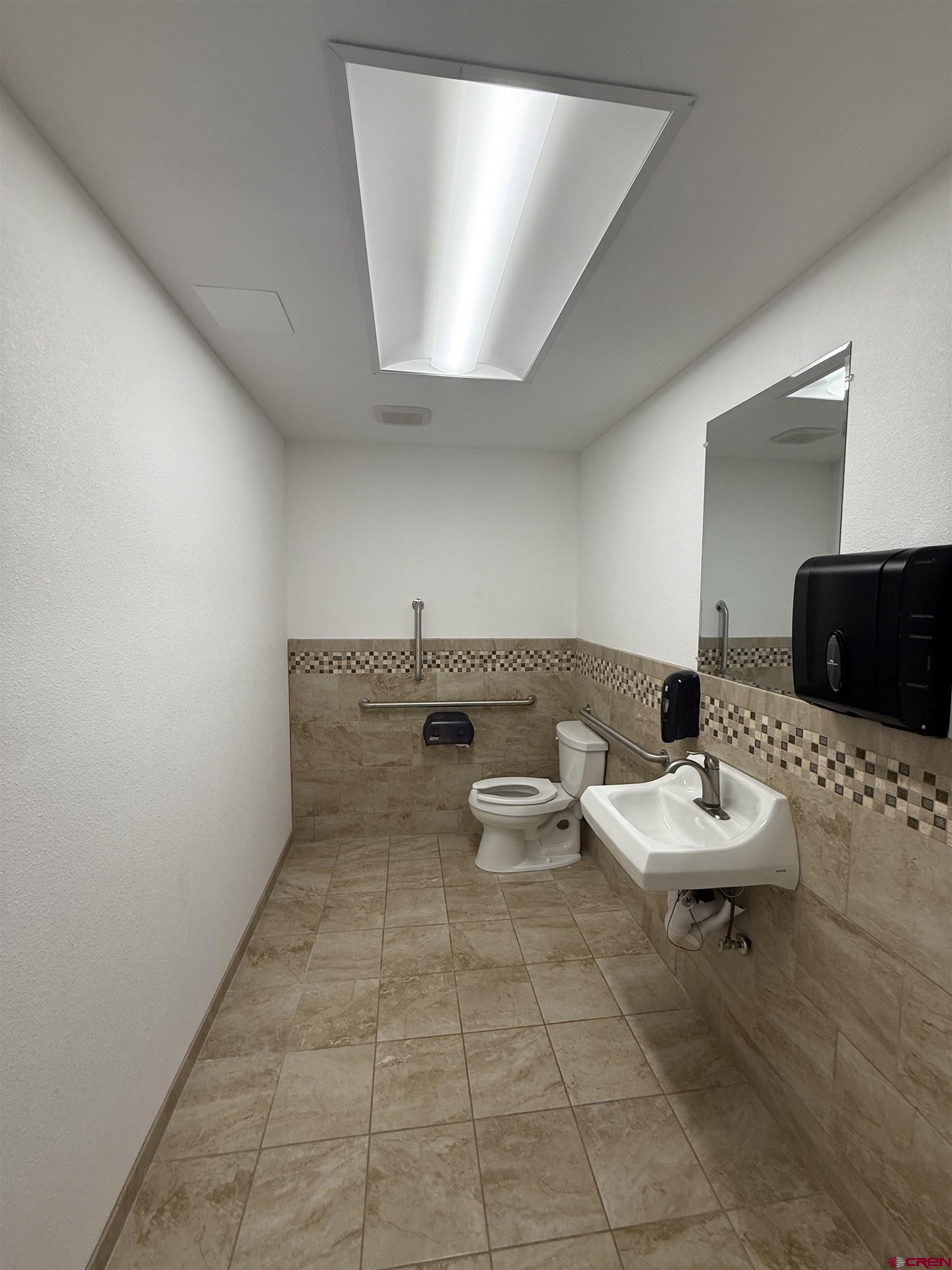 675 Industrial Boulevard, Unit 103 AND GARAGE Delta, CO 81416 - Photo 19 of 31 a living room with furniture and a wooden floor