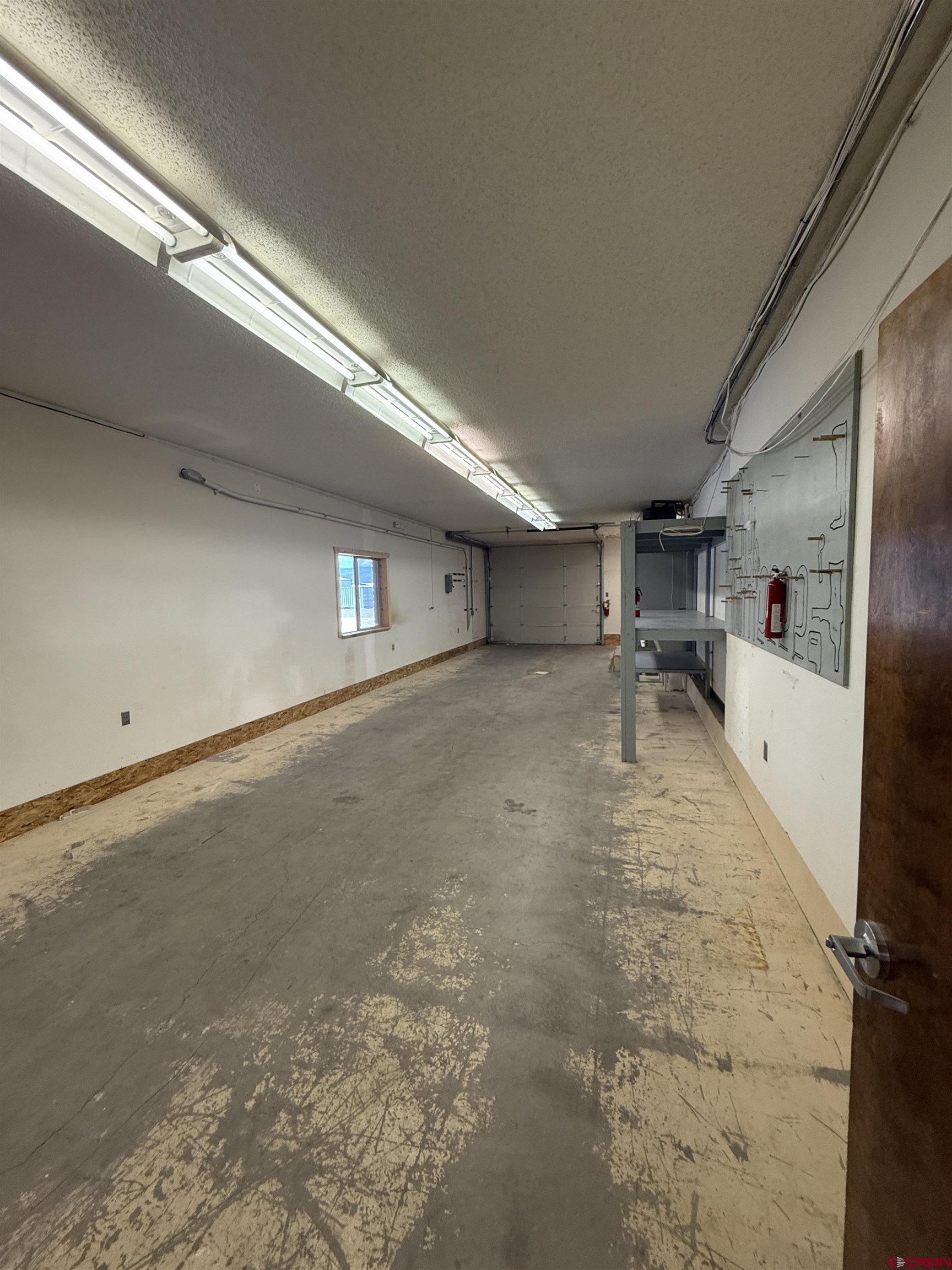 675 Industrial Boulevard, Unit 103 AND GARAGE Delta, CO 81416 - Photo 21 of 31 a view of a livingroom with furniture and a kitchen view