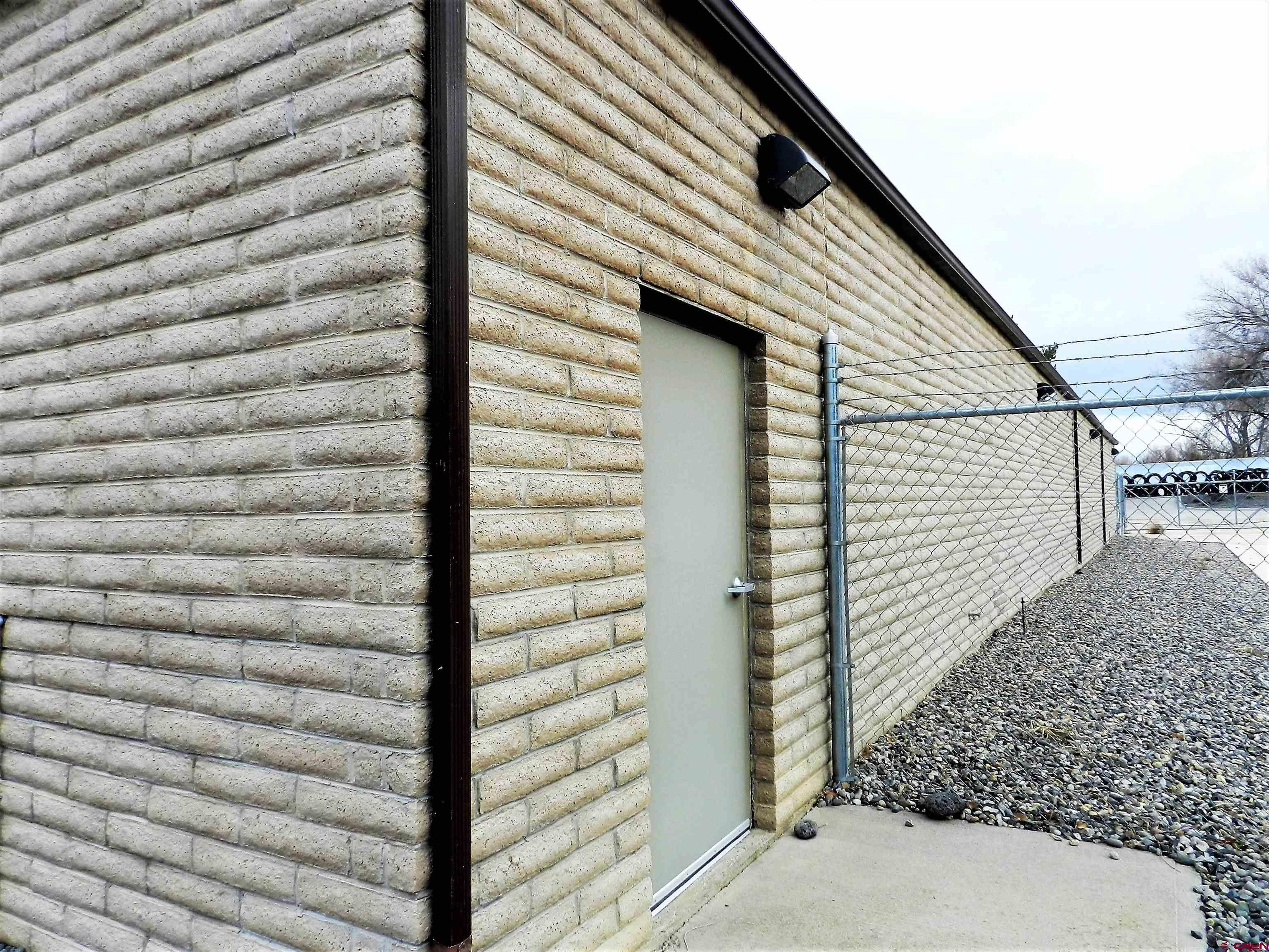675 Industrial Boulevard, Unit 103 AND GARAGE Delta, CO 81416 - Photo 26 of 31 a view of a wooden door and an outdoor space