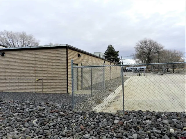 a view of outdoor space with yard and mountain view