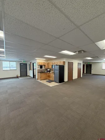 a view of a livingroom with furniture and a stove