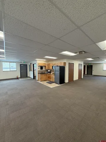 a view of a livingroom with furniture and a stove