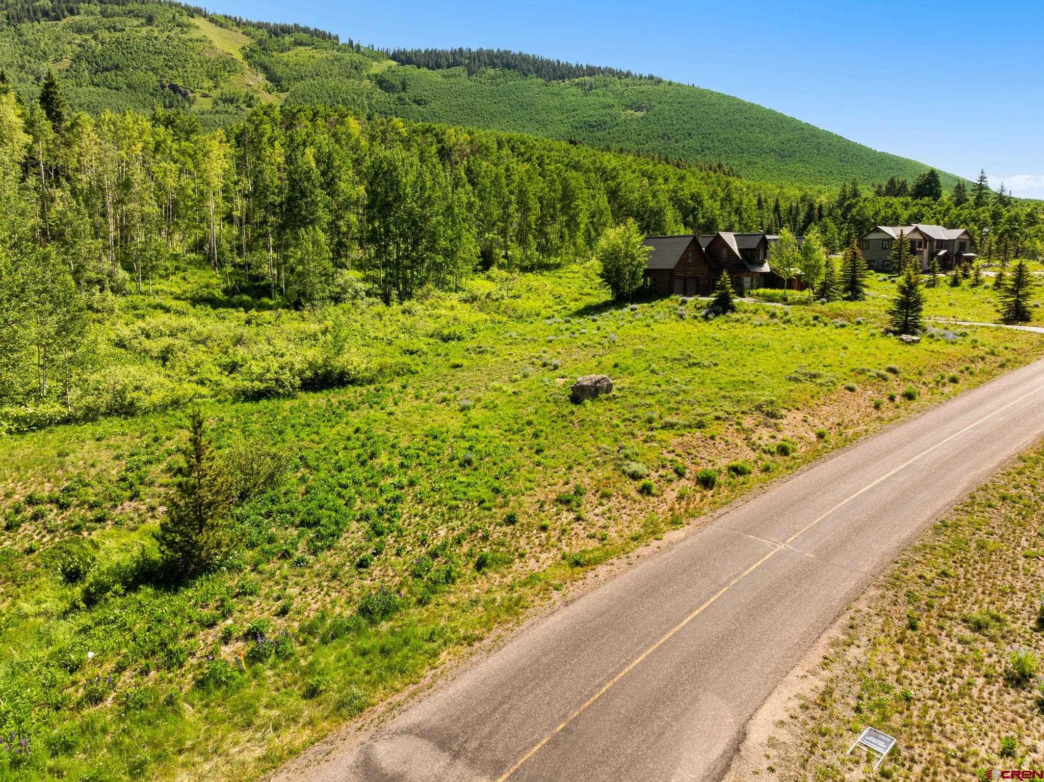 555 Meadow Drive Crested Butte, CO 81224 - Photo 13 of 24 a view of a lake from a window