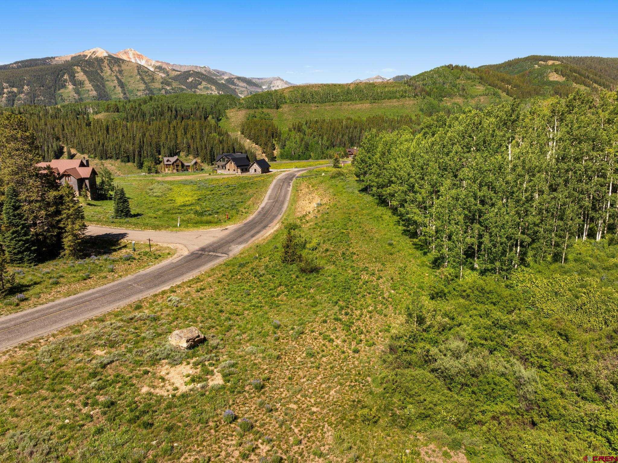 555 Meadow Drive Crested Butte, CO 81224 - Photo 3 of 24 a view of a town with mountains in the background
