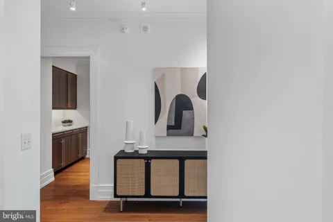 a bedroom with a bed and a lamp