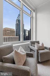 a bedroom with bed and a window