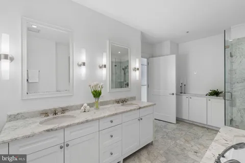 a hallway with wooden floor and furniture