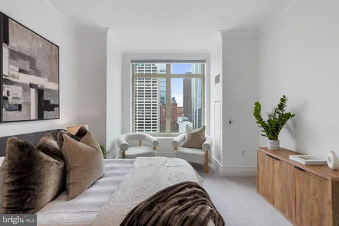 a view of a living room and entryway