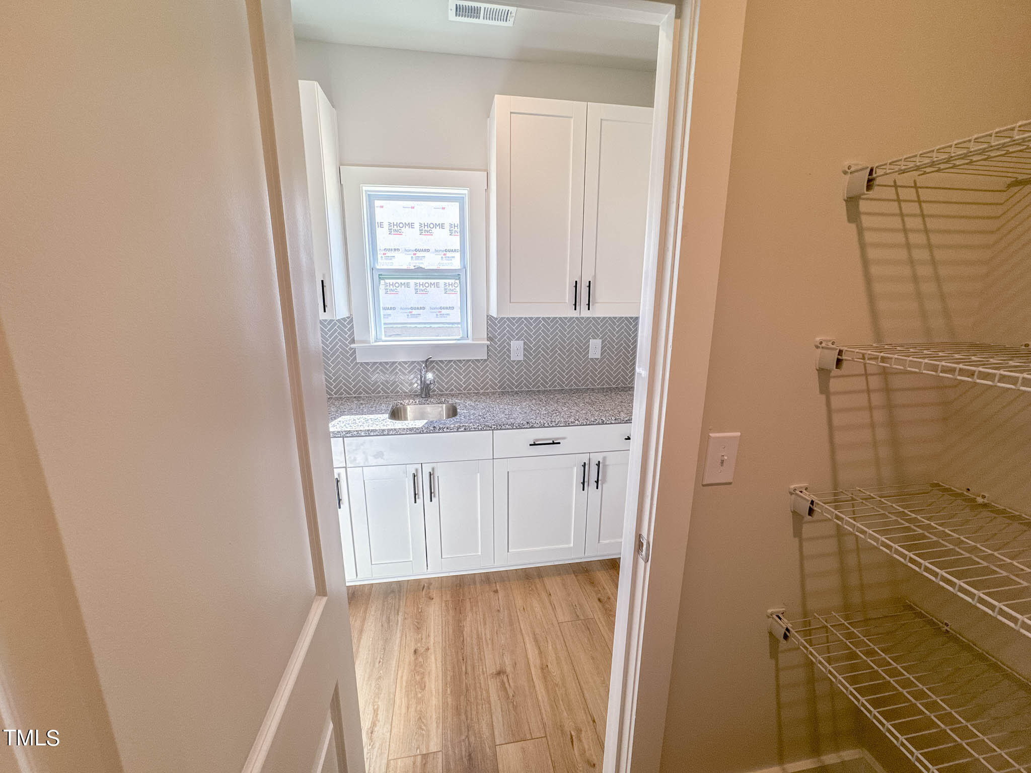 47 Beacon Hl Road, Unit SMITHFIELD Lillington, NC 27546 - Photo 18 of 69 a bathroom with a sink a mirror and a shower