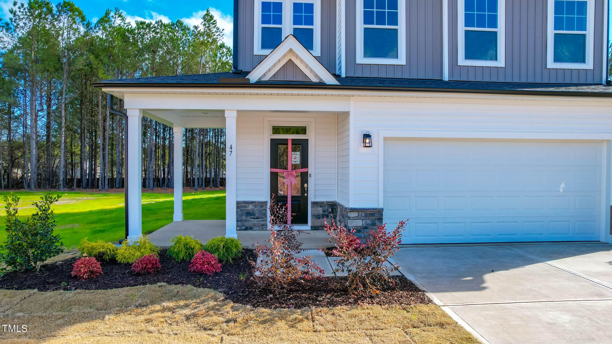 47 Beacon Hl Road, Unit SMITHFIELD Lillington, NC 27546 - Photo 2 of 69 a view of a lounge chair in the backyard of a house