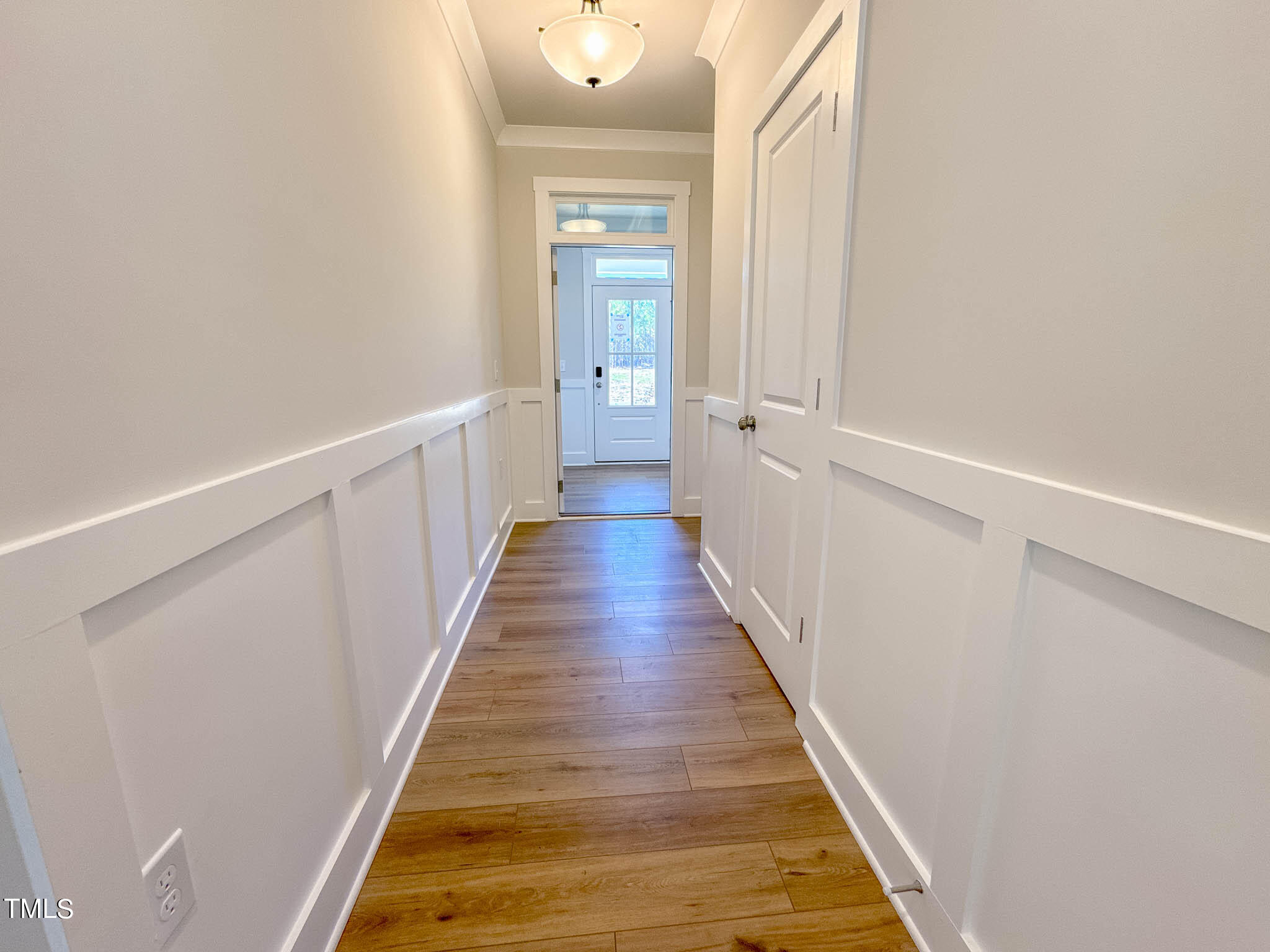 47 Beacon Hl Road, Unit SMITHFIELD Lillington, NC 27546 - Photo 26 of 69 a view of a hallway with wooden floor and staircase