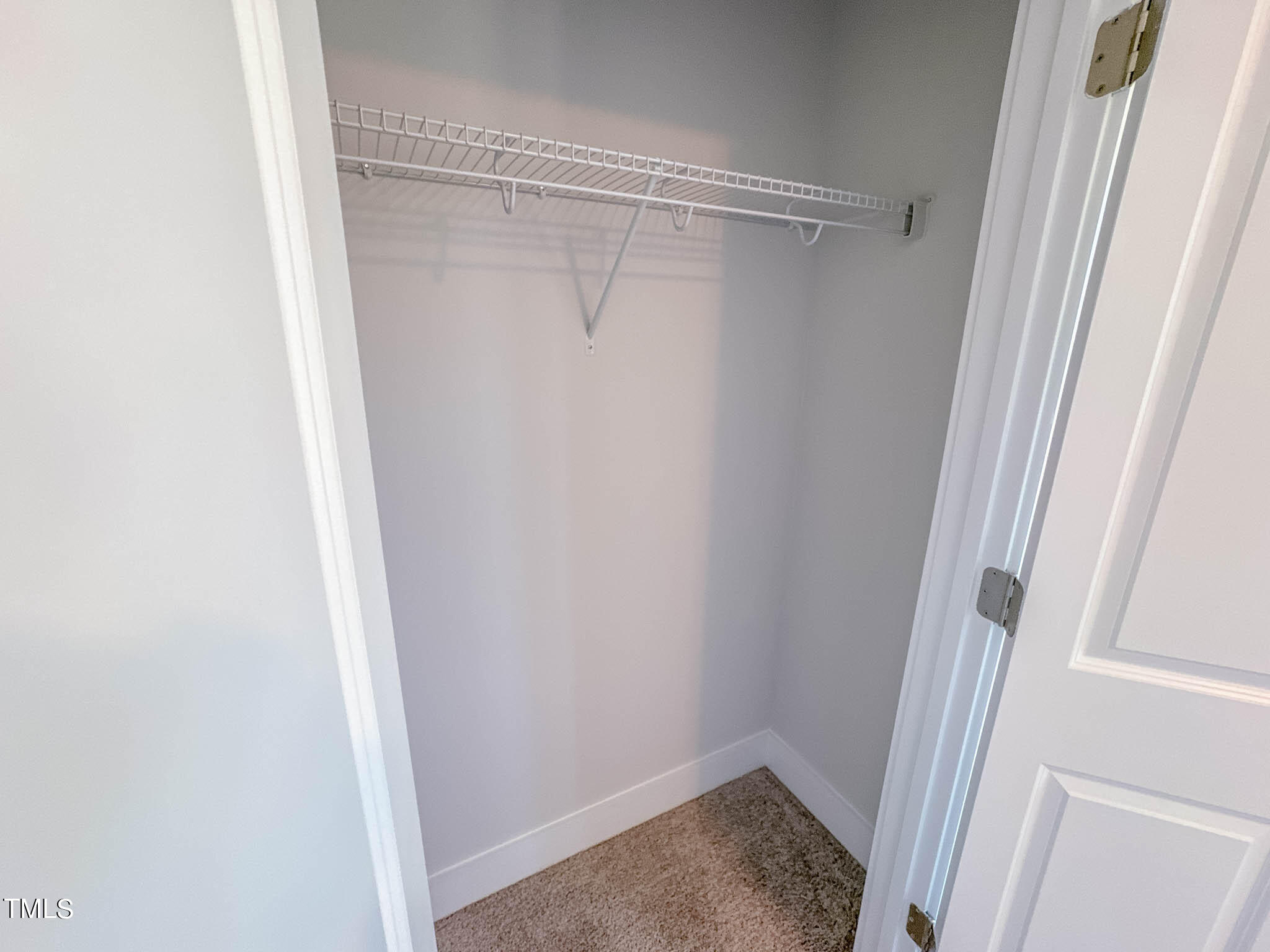 47 Beacon Hl Road, Unit SMITHFIELD Lillington, NC 27546 - Photo 37 of 69 a view of a room with rack on the wall