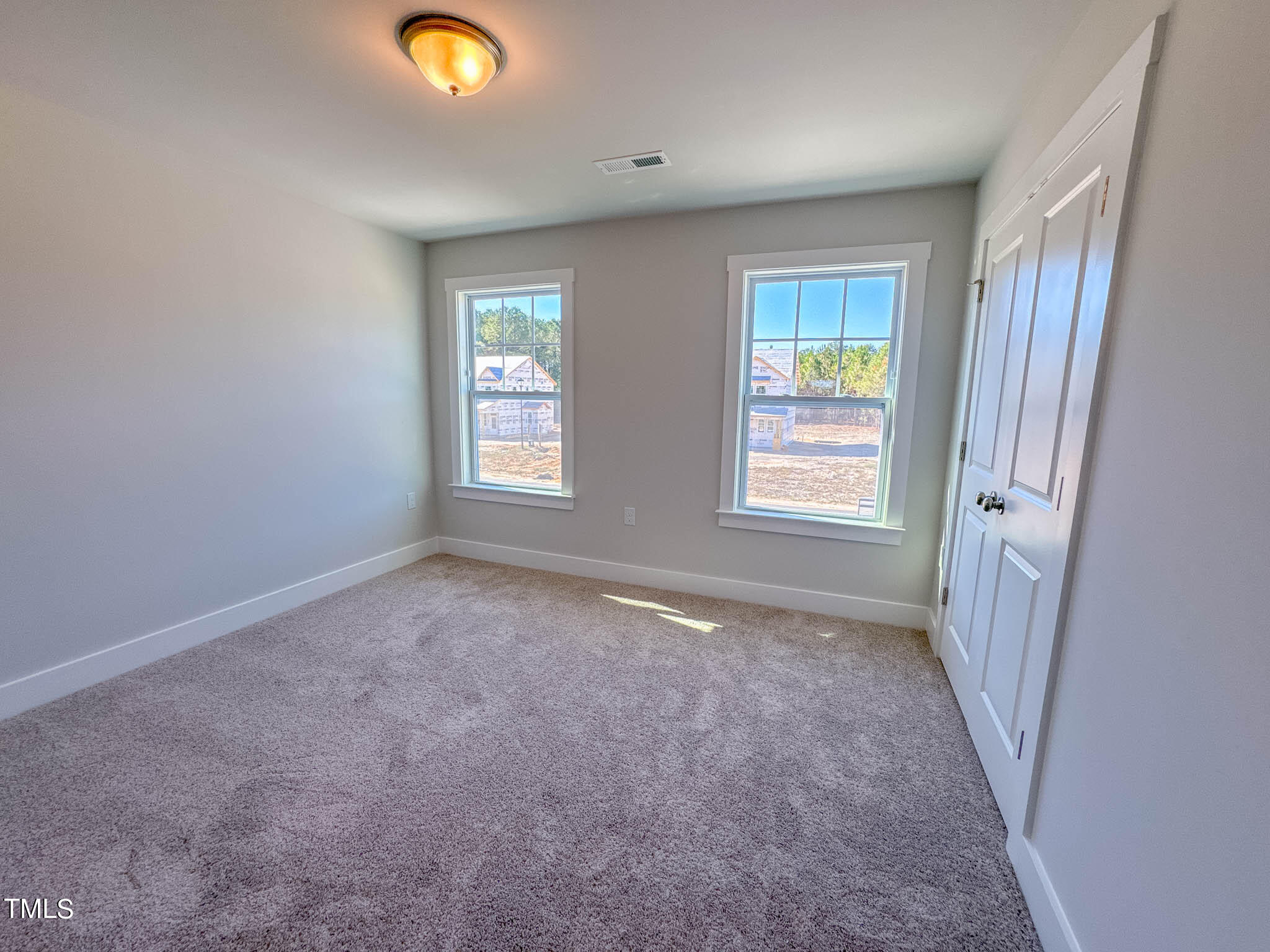 47 Beacon Hl Road, Unit SMITHFIELD Lillington, NC 27546 - Photo 39 of 69 wooden floor and window in an empty room