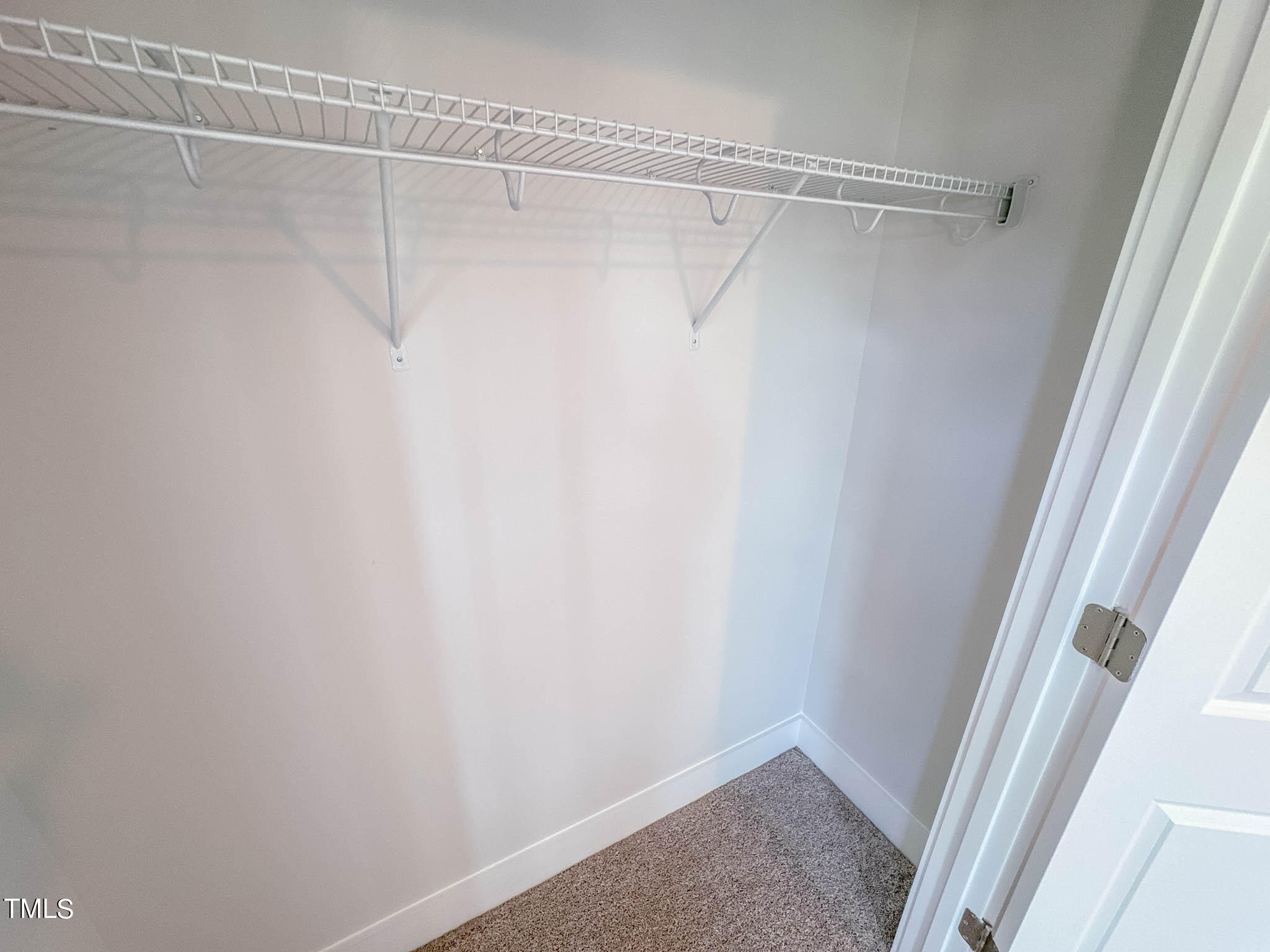 47 Beacon Hl Road, Unit SMITHFIELD Lillington, NC 27546 - Photo 43 of 69 a view of a room with racks on the wall