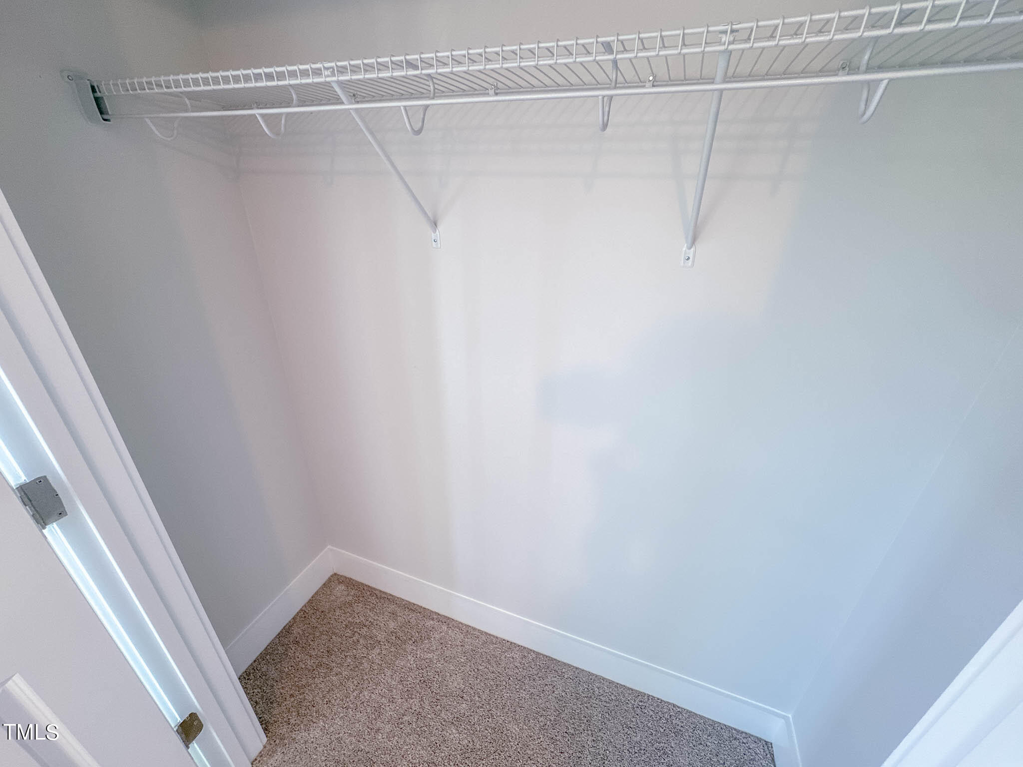 47 Beacon Hl Road, Unit SMITHFIELD Lillington, NC 27546 - Photo 44 of 69 a view of a room with racks on the wall