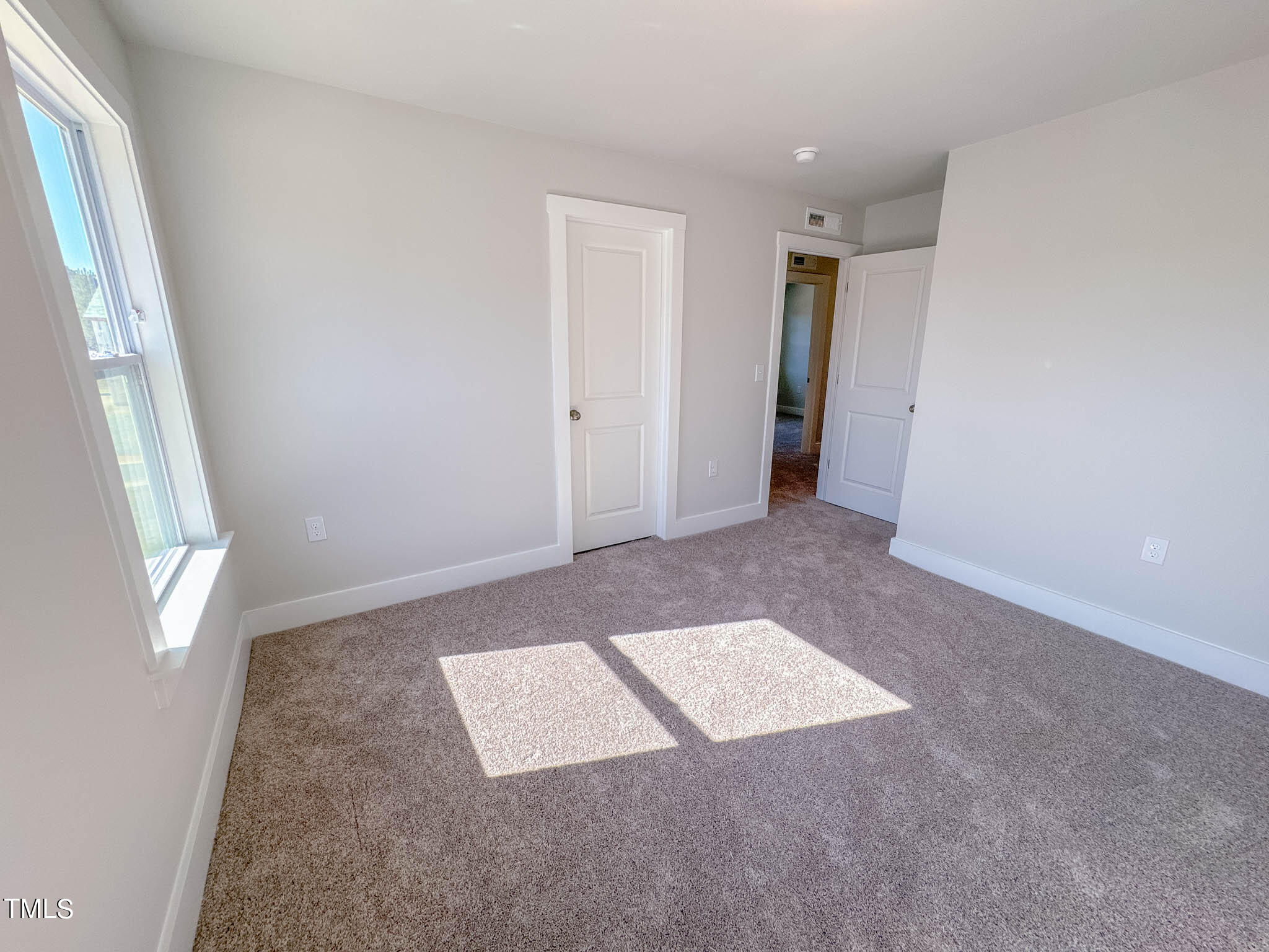 47 Beacon Hl Road, Unit SMITHFIELD Lillington, NC 27546 - Photo 47 of 69 an empty room with windows