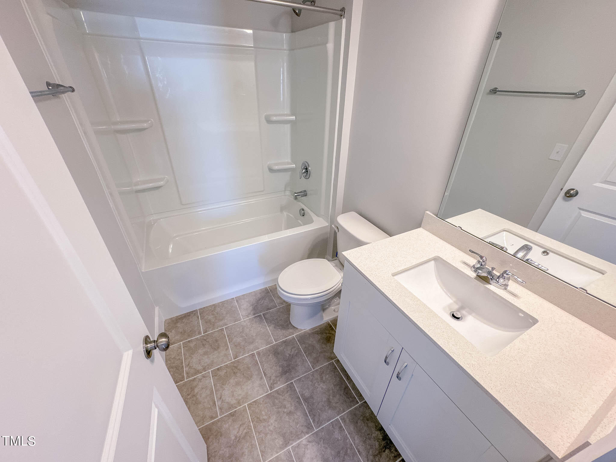 47 Beacon Hl Road, Unit SMITHFIELD Lillington, NC 27546 - Photo 52 of 69 a bathroom with a sink a toilet a mirror and shower