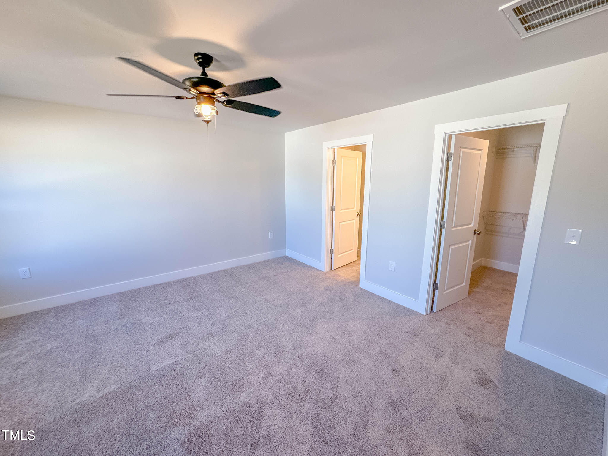 47 Beacon Hl Road, Unit SMITHFIELD Lillington, NC 27546 - Photo 54 of 69 a view of a room with a ceiling fan
