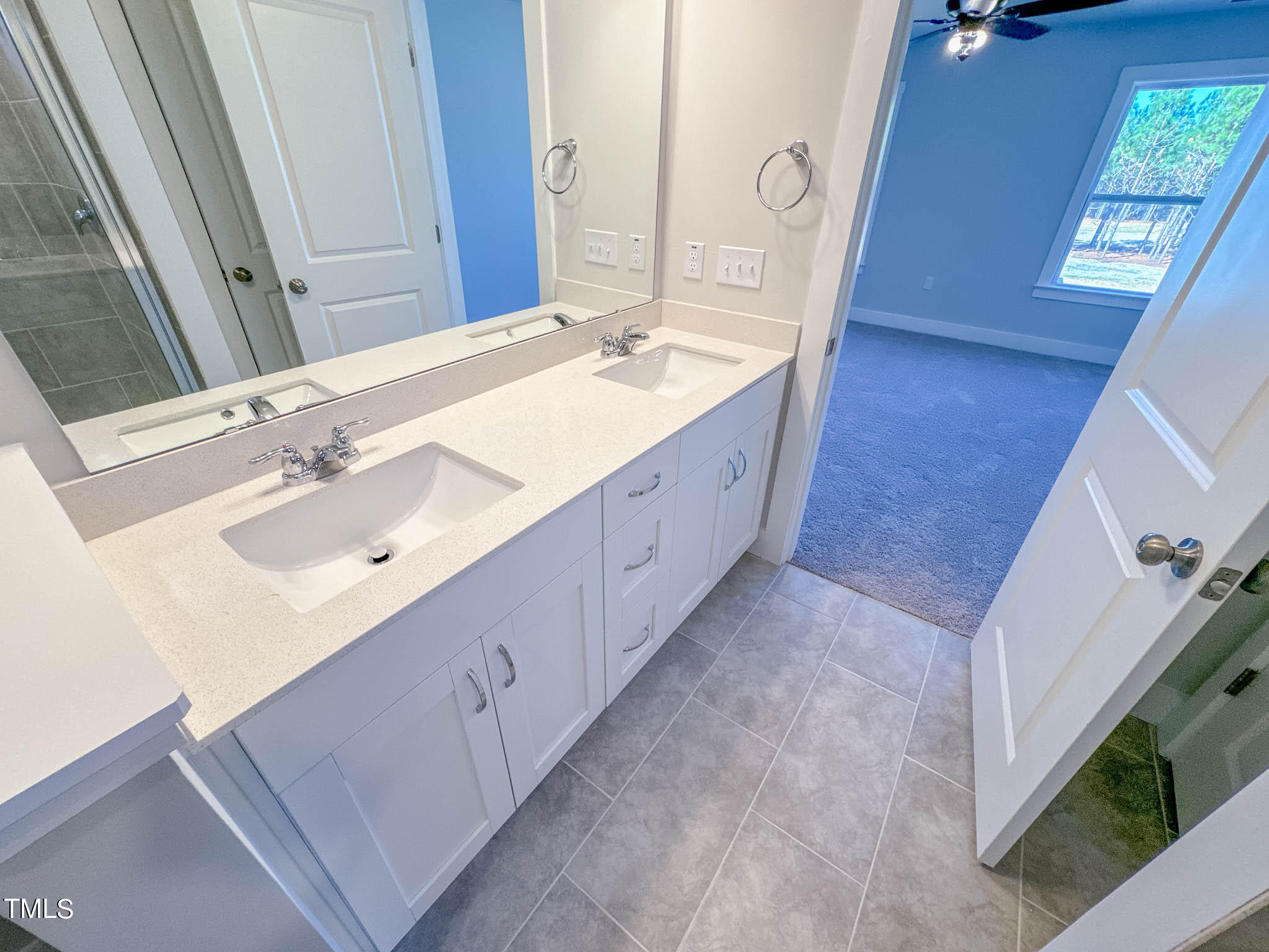 47 Beacon Hl Road, Unit SMITHFIELD Lillington, NC 27546 - Photo 62 of 69 a spacious bathroom with a double vanity sink mirror and