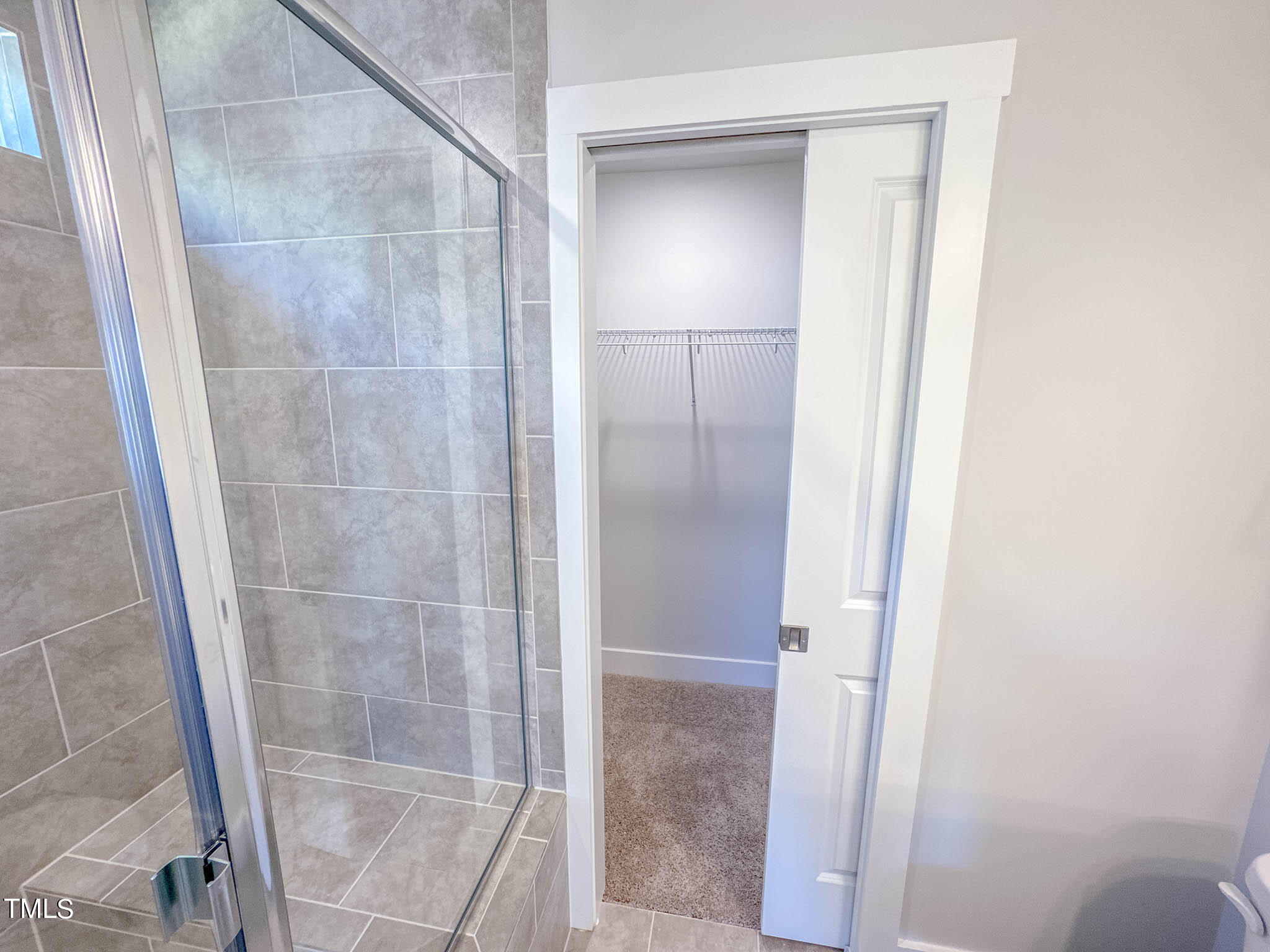 47 Beacon Hl Road, Unit SMITHFIELD Lillington, NC 27546 - Photo 64 of 69 a bathroom with a glass shower door