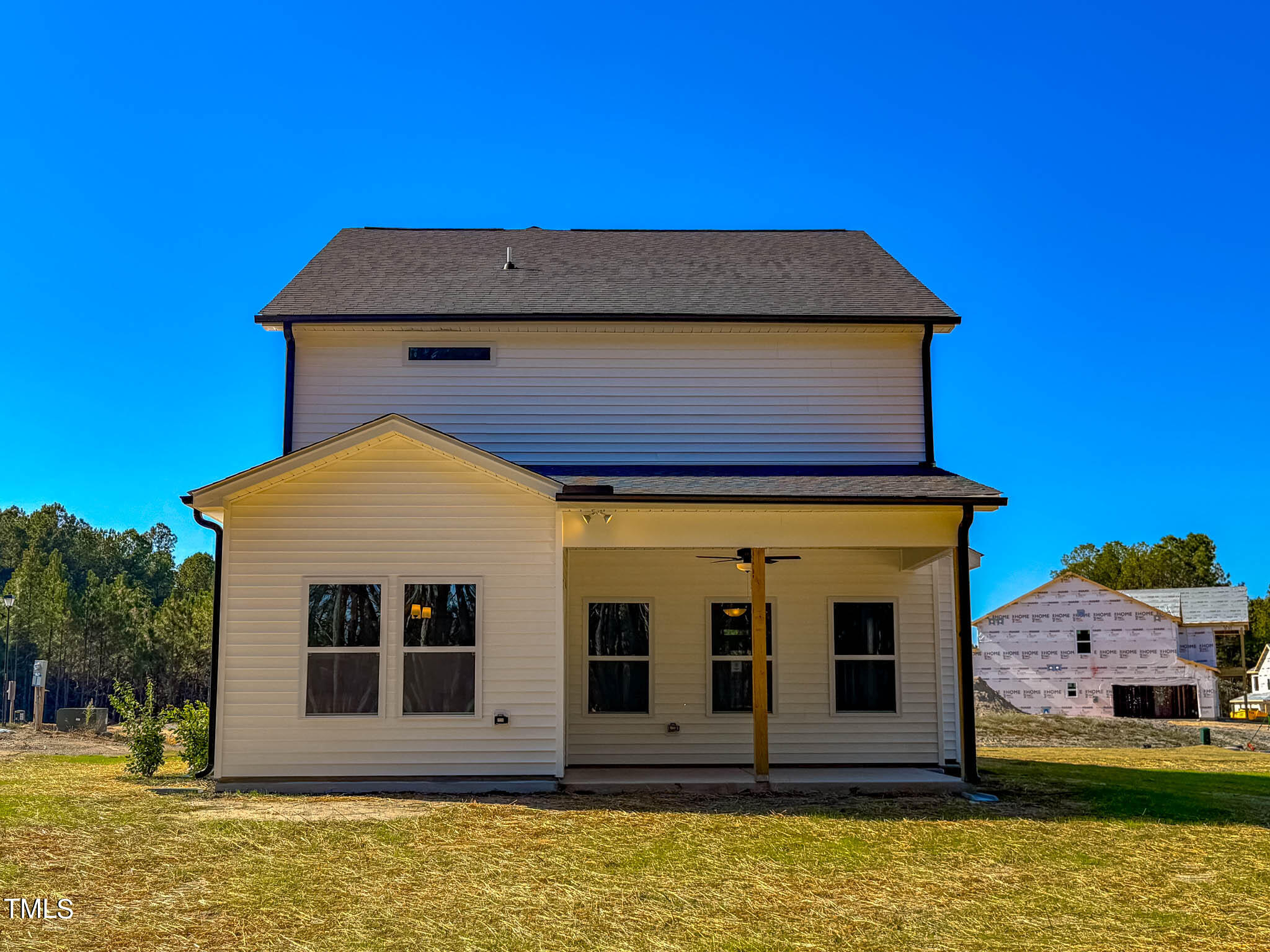 47 Beacon Hl Road, Unit SMITHFIELD Lillington, NC 27546 - Photo 67 of 69 a view of a house with a small yard
