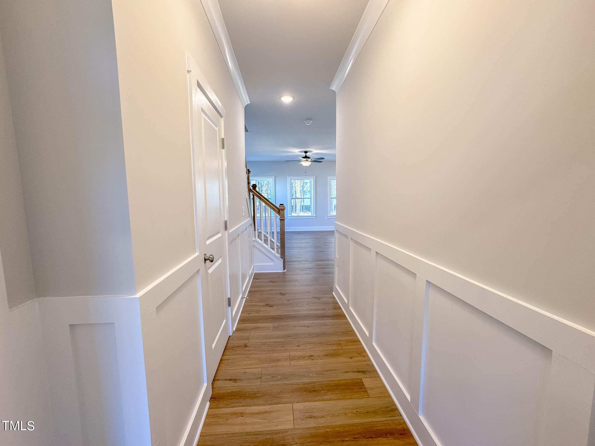 47 Beacon Hl Road, Unit SMITHFIELD Lillington, NC 27546 - Photo 8 of 69 a view of a hallway with wooden floor and staircase