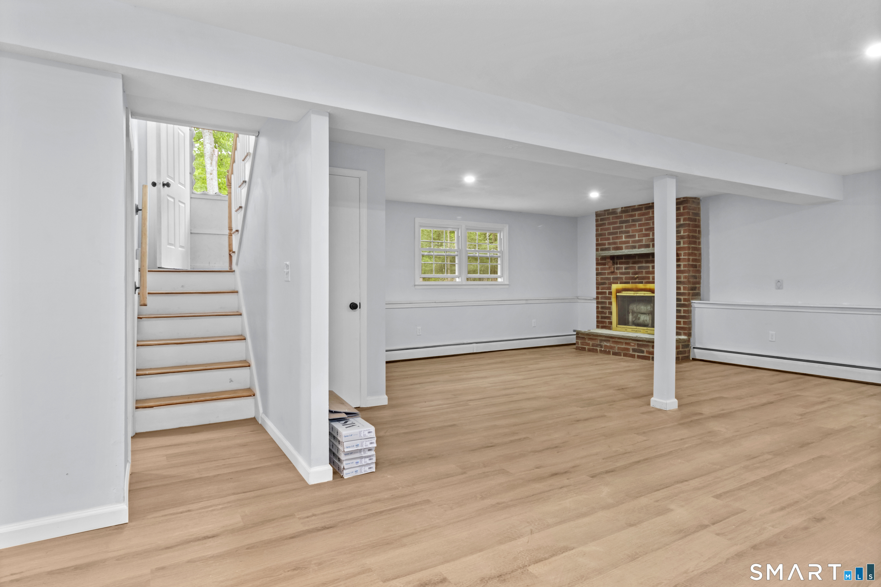 20 Quiet Woods Road East Hampton, CT 06424 - Photo 24 of 40 an empty room with wooden floor and windows
