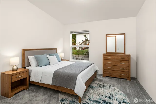 a bedroom with a bed and a dresser