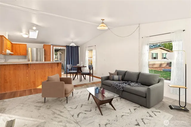 a living room with furniture and a table