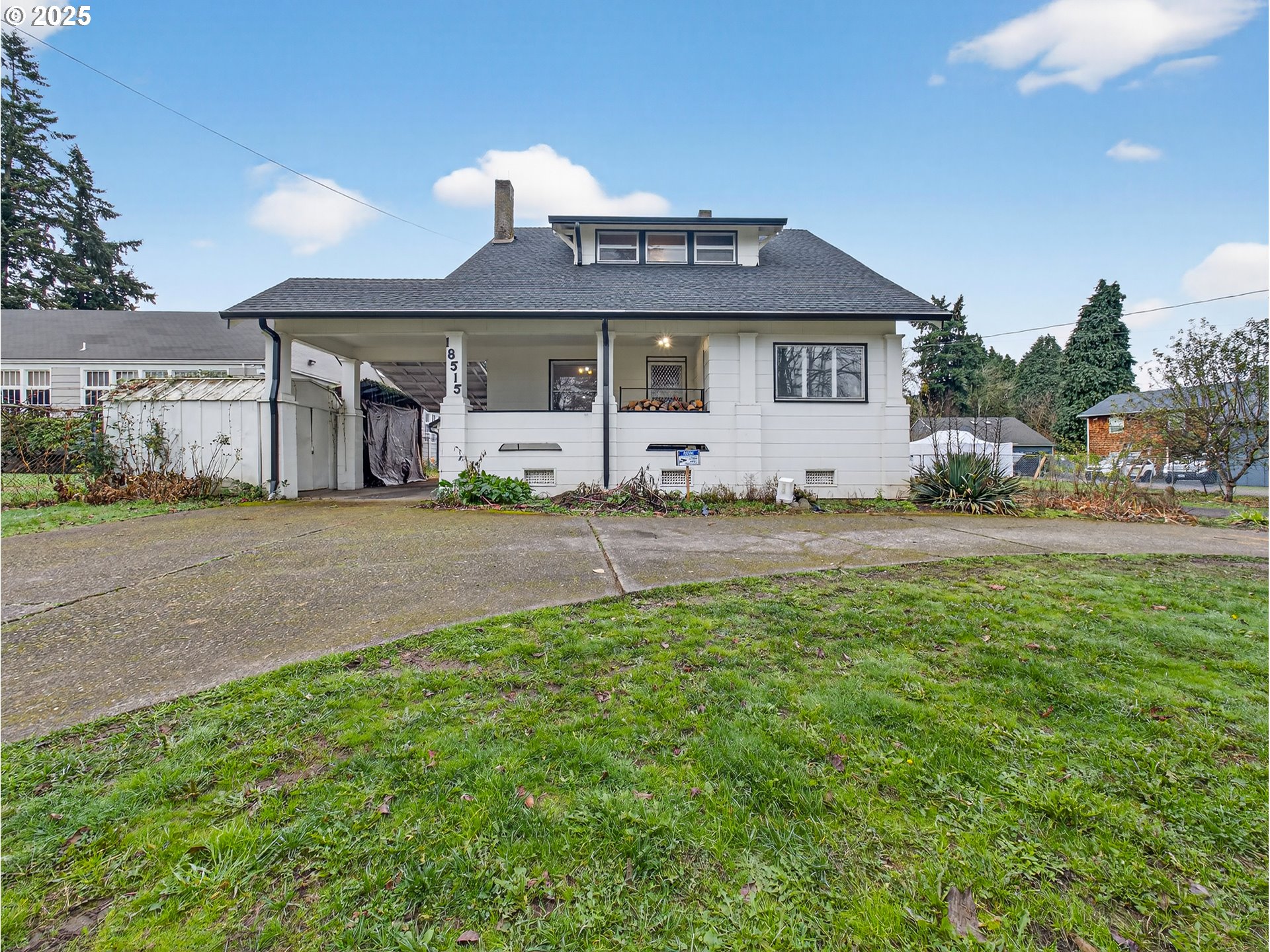 18515 Southeast River Road Milwaukie, OR 97267 - Photo 1 of 41 a front view of a house with a garden and yard